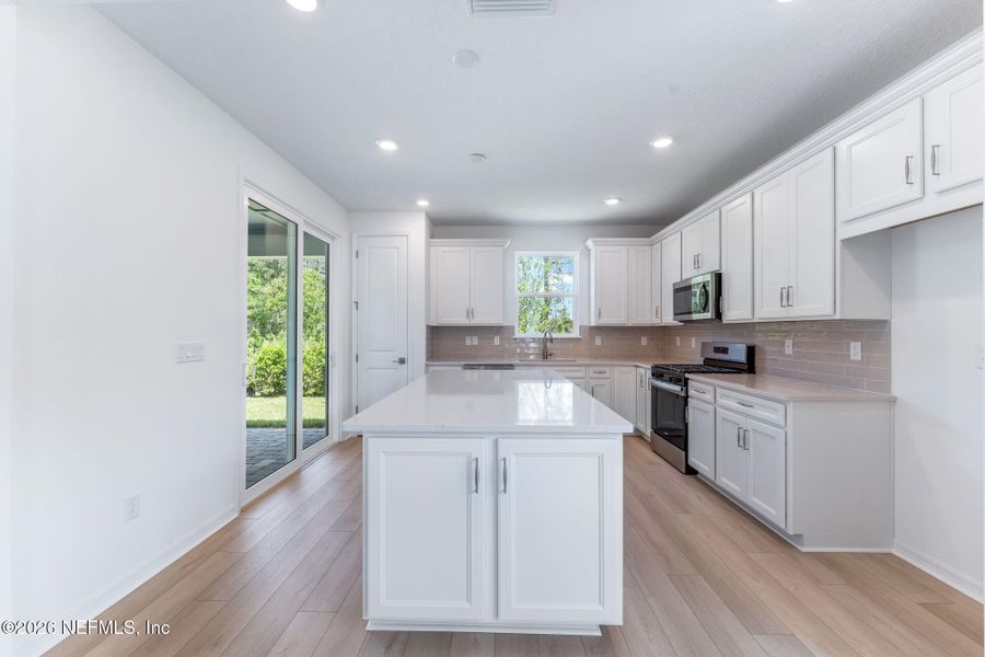 Furnished interior view inside a new home in Del Webb Wildlight, Yulee (Image 6).