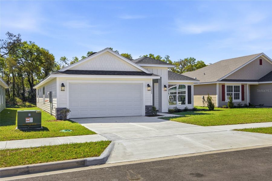 Front exterior of a new home in Kirkland Farms, Alachua, FL, highlighting curb appeal (Image 2). Front exterior of a new home in Kirkland Farms, Alachua, FL, highlighting curb appeal (Image 2).