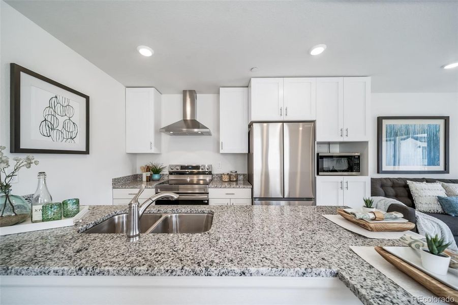 Furnished interior view inside a new home in Reunion, Commerce City (Image 9).