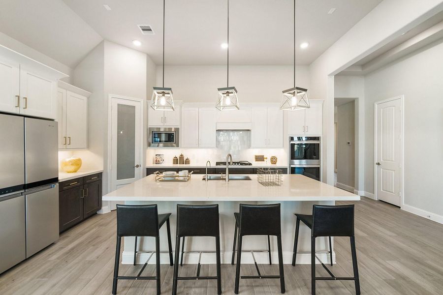 Furnished interior view inside a new home in Ellwood, Iowa Colony (Image 12).