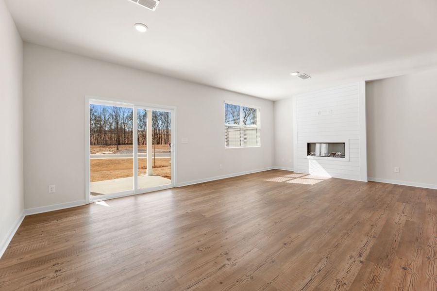 A room with a wood floor and a wood floor.
