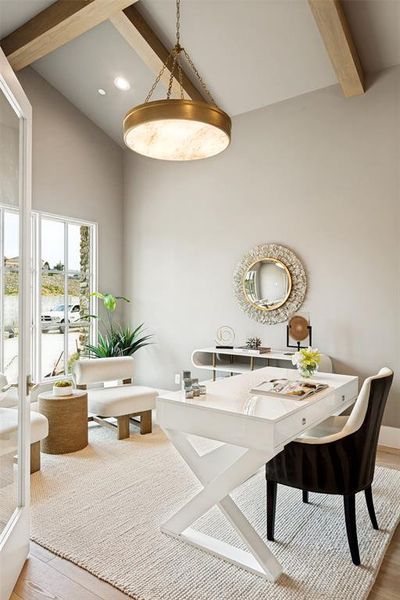 Handsome study with valued and beamed ceilings.