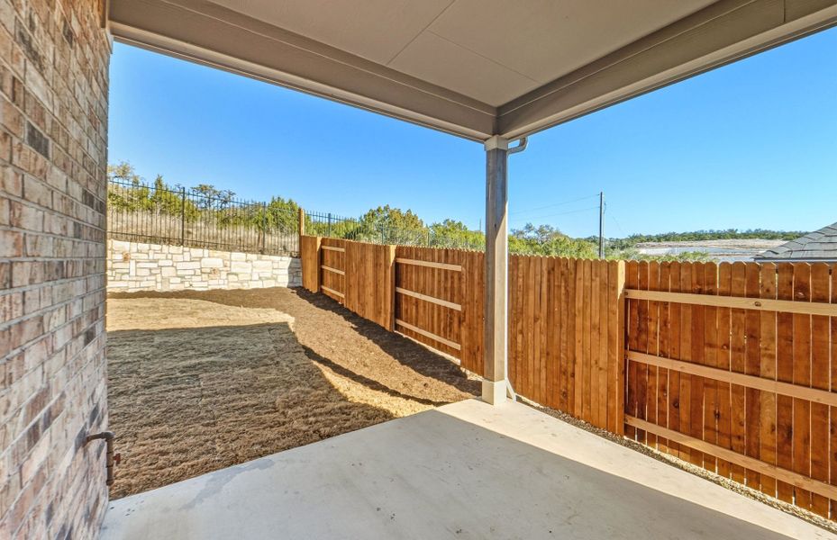 Exterior details and patio area of a home in West Cypress Hills, Spicewood (Image 29).