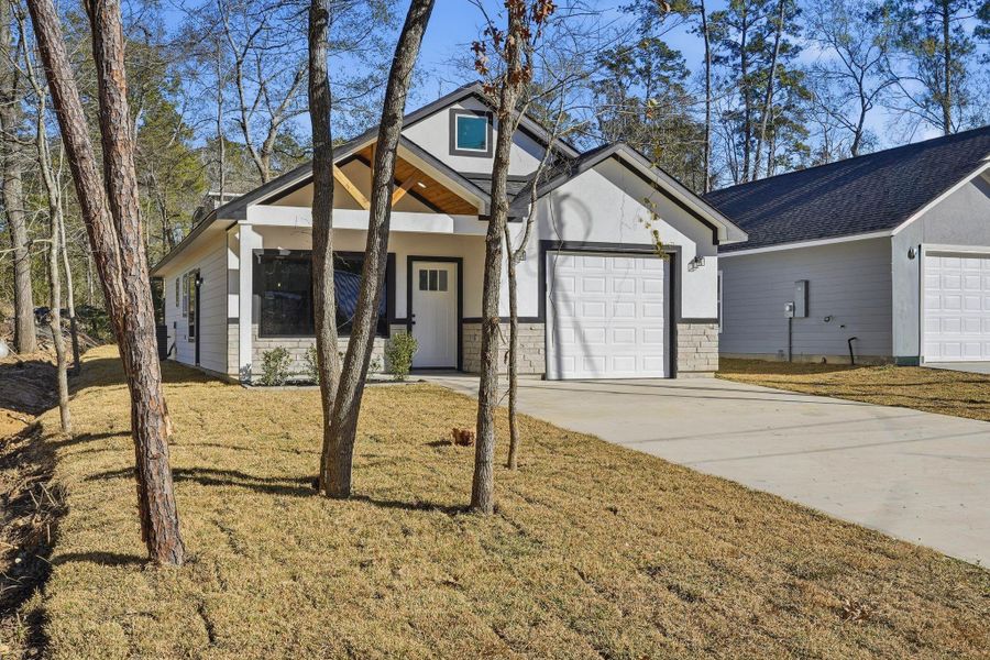 Front exterior of a new home in , Willis, TX, highlighting curb appeal (Image 19).