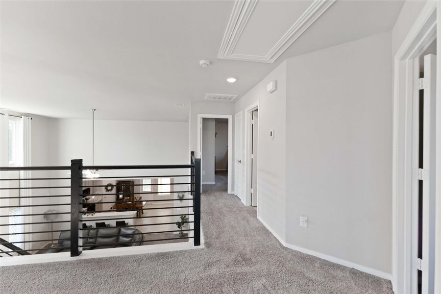 The upstairs layout ensures separation from the primary suite for extra privacy. The upstairs layout ensures separation from the primary suite for extra privacy.