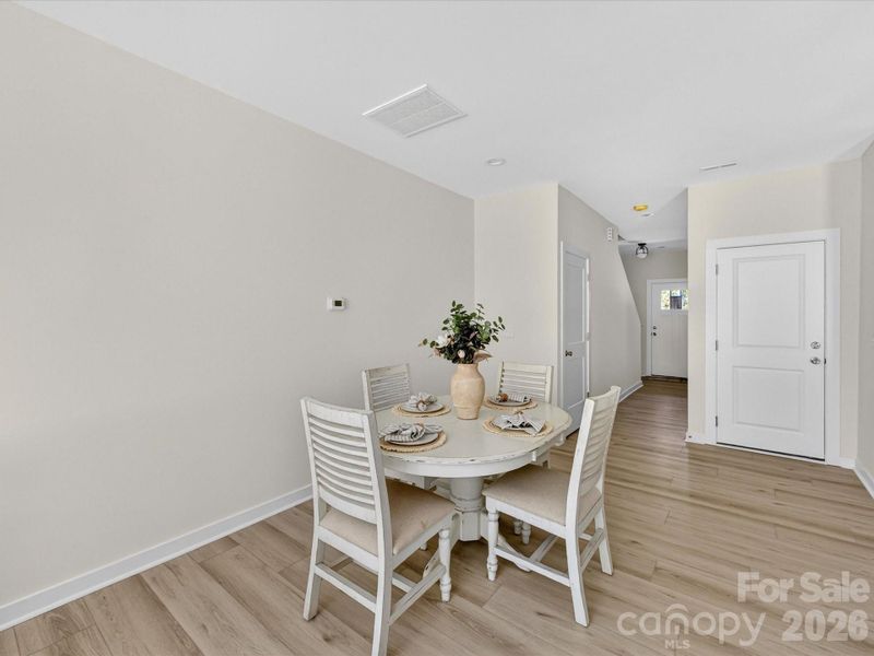 Open-concept kitchen flows seamlessly into a bright breakfast nook and living area, creating an inviting space ideal for both everyday dining and entertaining. Open-concept kitchen flows seamlessly into a bright breakfast nook and living area, creating an inviting space ideal for both everyday dining and entertaining.