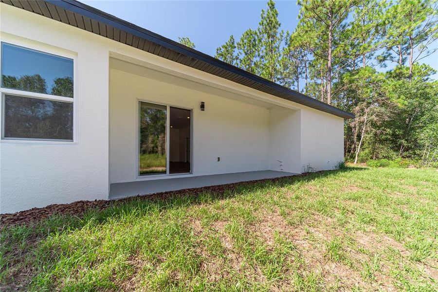 Exterior details and patio area of a home in , Citrus Springs (Image 28).