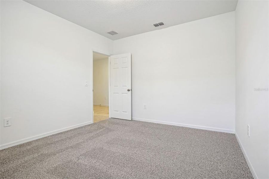 Spacious, unfurnished interior of a new home in Lake Deer Estates - Signature Series, Poinciana (Image 25). Spacious, unfurnished interior of a new home in Lake Deer Estates - Signature Series, Poinciana (Image 25).