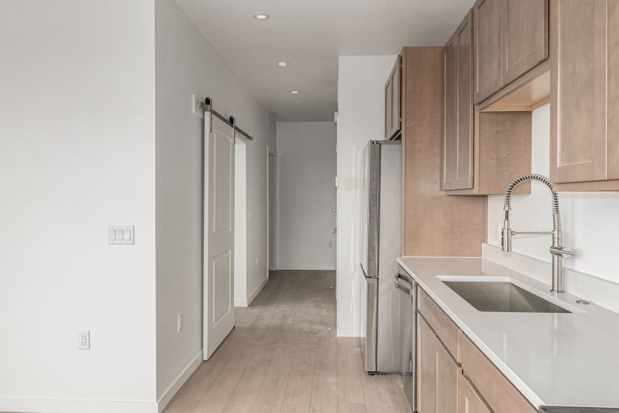 Furnished interior in a model home at The Scene at Sloan's Lake in Denver (Image 19).