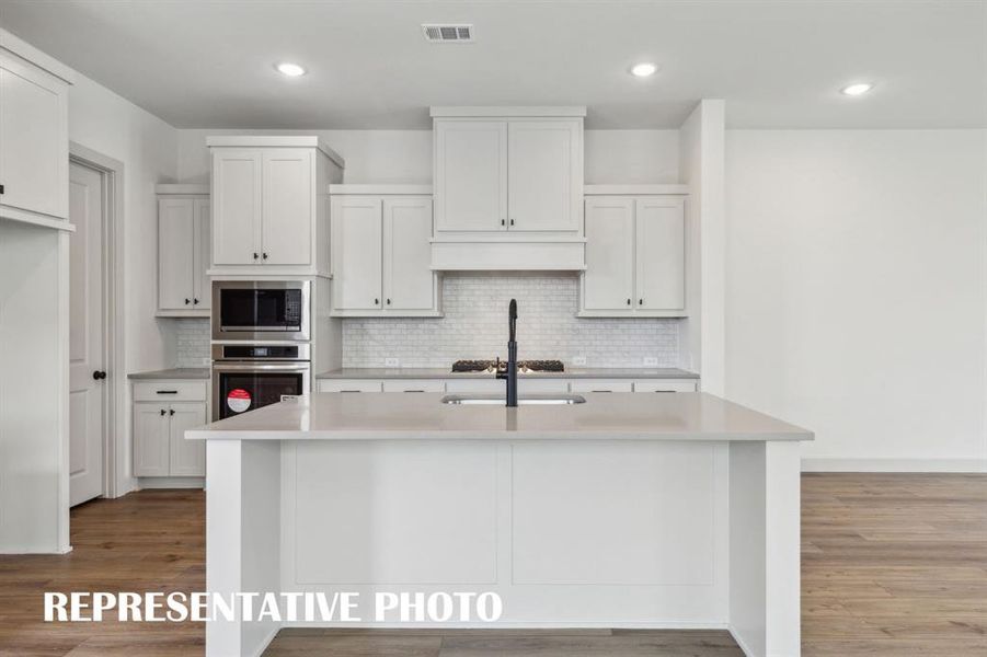 Your fantastic new kitchen features an oversized island perfect for friends and family to gather round! REPRESENTATIVE PHOTO Your fantastic new kitchen features an oversized island perfect for friends and family to gather round! REPRESENTATIVE PHOTO