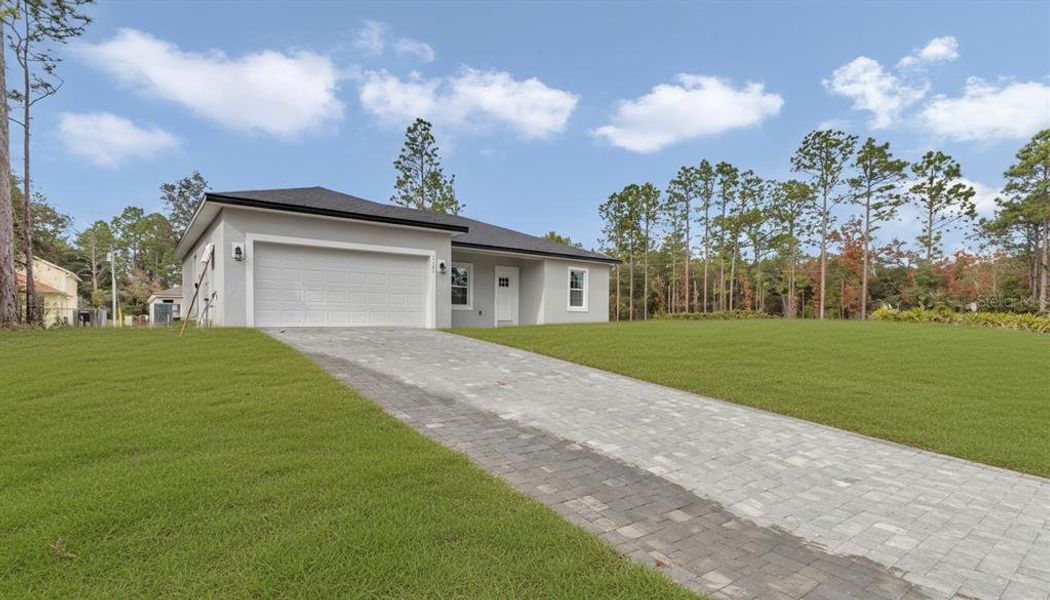 Front exterior of a new home in , Citrus Springs, FL, highlighting curb appeal (Image 1). Front exterior of a new home in , Citrus Springs, FL, highlighting curb appeal (Image 1).