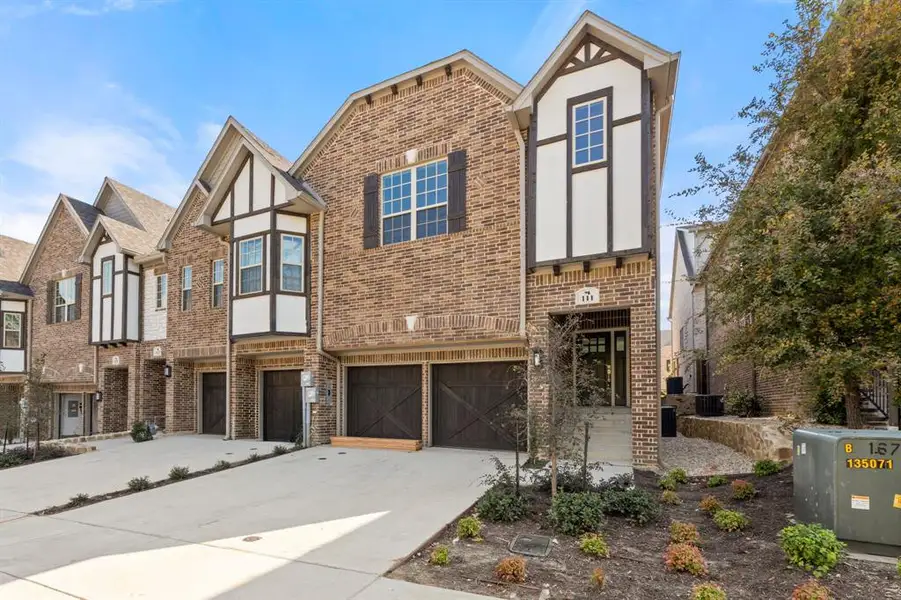 Front exterior of a new home in , Lewisville, TX, highlighting curb appeal (Image 21).