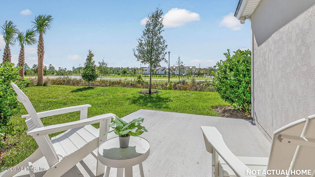 Exterior details and patio area of a home in Sawmill Branch, Palm Coast (Image 2).