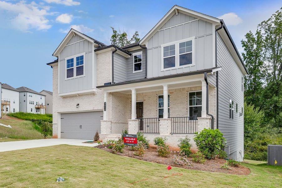 Front exterior of a new home in Falls Creek, Flowery Branch, GA, highlighting curb appeal (Image 20).