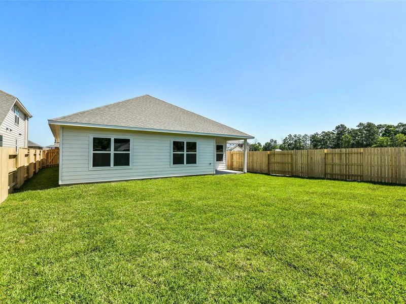 Exterior details and patio area of a home in Sundance Cove, Crosby (Image 19).