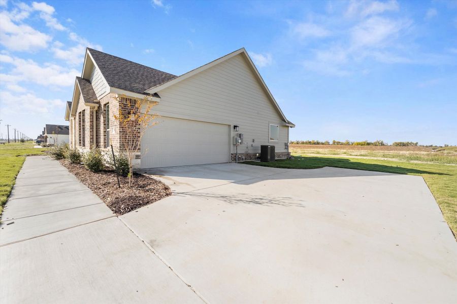 Front exterior of a new home in Clear Sky Addition, Valley View, TX, highlighting curb appeal (Image 26).