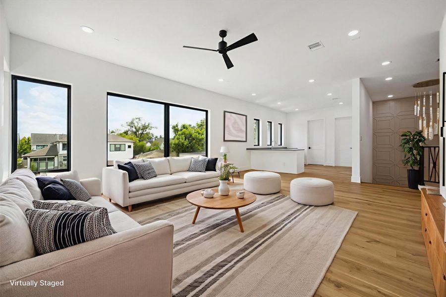 One of a kind game/media room, features a large wet bar and abundant natural light. This is the perfect area for family and friends gathering.