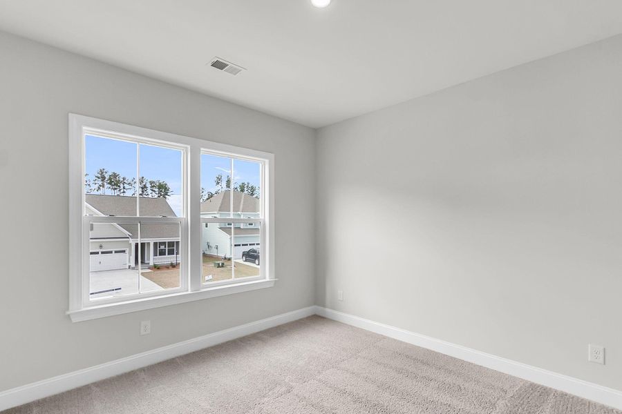 Spacious, unfurnished interior of a new home in Tidewater at Lakes of Cane Bay, Summerville (Image 49).