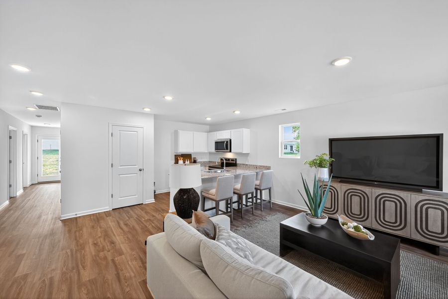 A living room with a tv and couches.