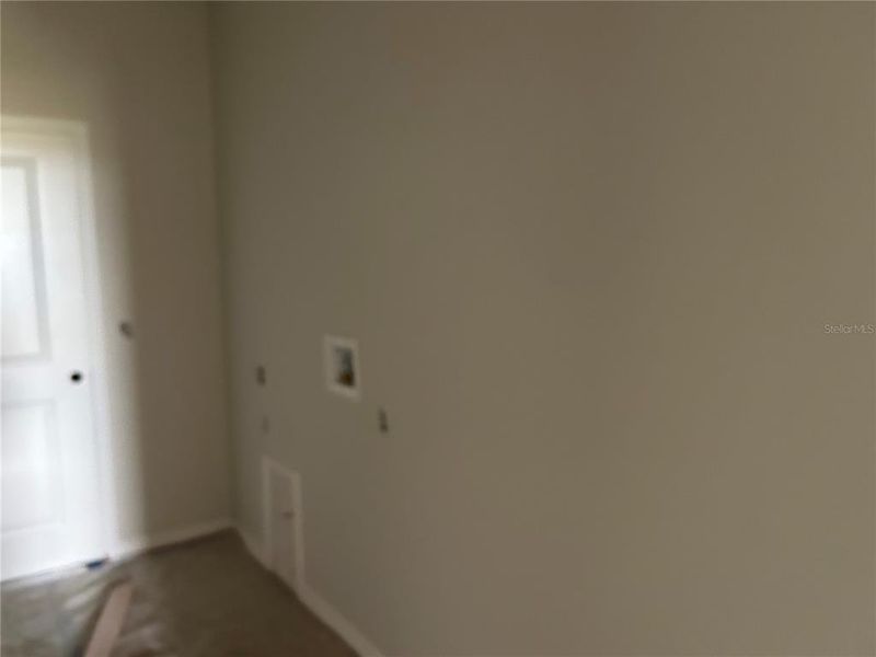 In-progress construction of a new home in Oakfield Trails Signature, Parrish, FL (Image 35).