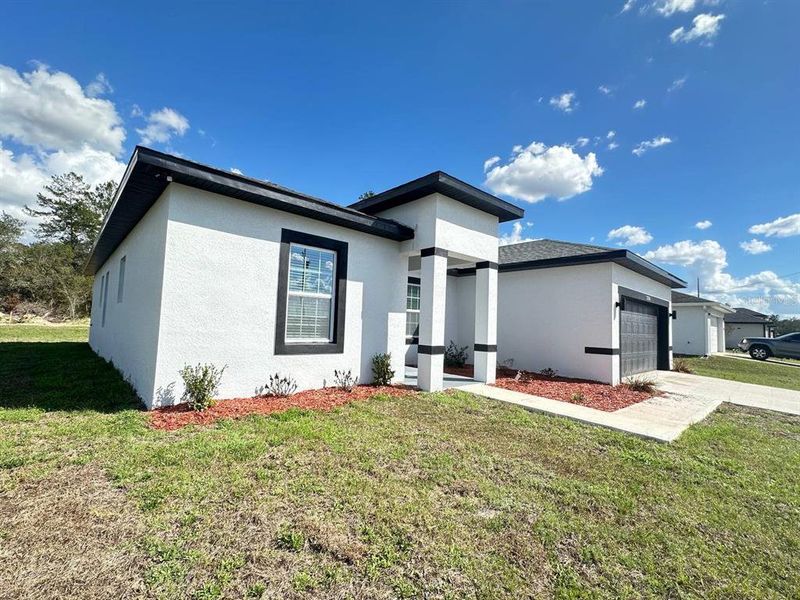 Front exterior of a new home in , Ocala, FL, highlighting curb appeal (Image 21).