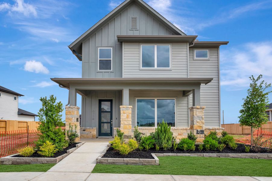 Front exterior of a new home in Jubilee - Grove Row Collection, Hockley, TX, highlighting curb appeal (Image 1). Front exterior of a new home in Jubilee - Grove Row Collection, Hockley, TX, highlighting curb appeal (Image 1).