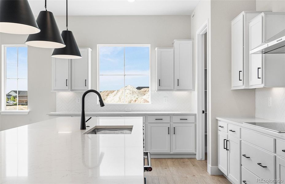 Furnished interior view inside a new home in Hilltop at Inspiration, Aurora (Image 17).