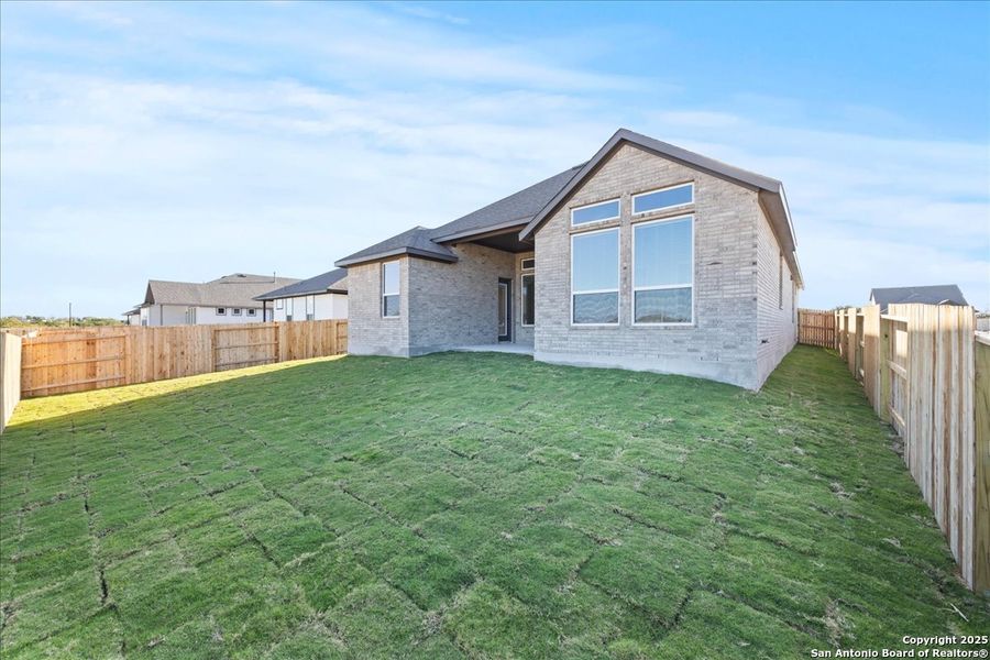 Exterior details and patio area of a home in Village at Three Oaks, Seguin (Image 4).