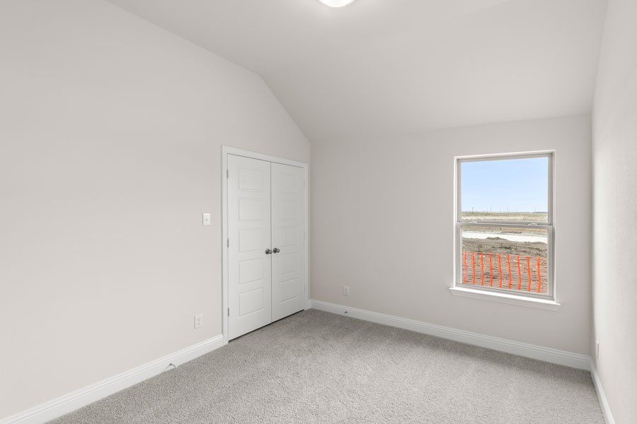 Representative exterior photo of a completed home built from the Kingston by Impression Homes in Timberbrook, Justin, TX (Image 23).