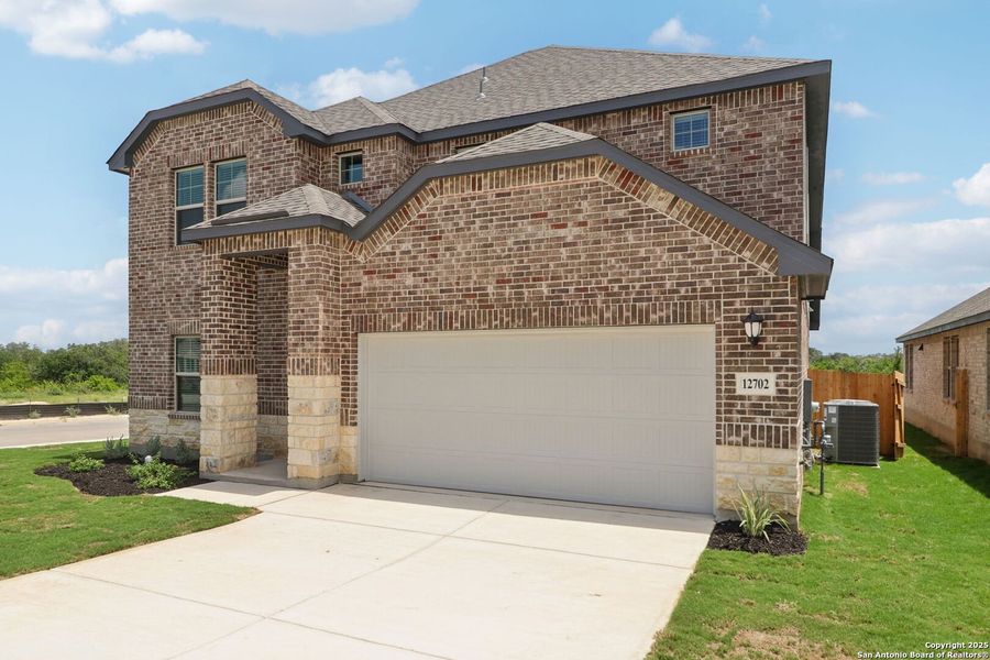 Front exterior of a new home in Arcadia Ridge - Classic Series, San Antonio, TX, highlighting curb appeal (Image 21).