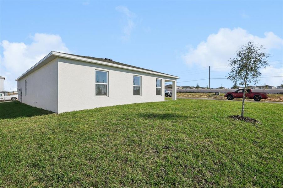Exterior details and patio area of a home in The Enclave at Scenic Terrace, Haines City (Image 8).