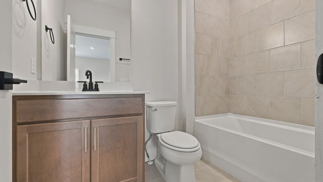 Classic bathroom with essentials as well as a bathtub.