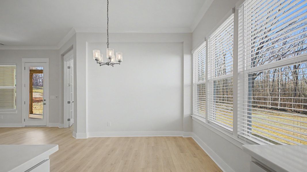 Dining area set near bright windows