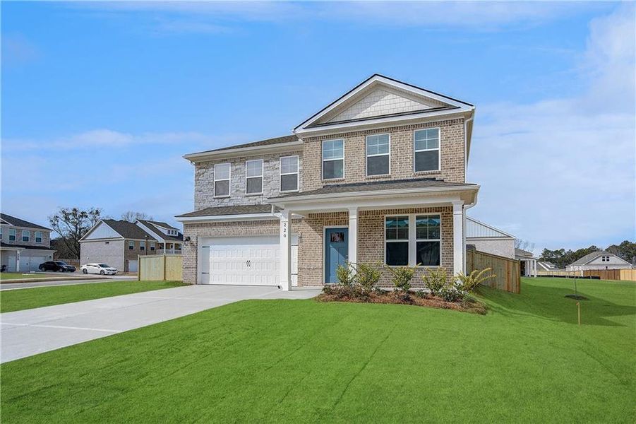 Front exterior of a new home in Burchwood, Stockbridge, GA, highlighting curb appeal (Image 24).