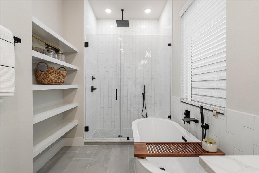 A functional yet refined layout anchored by a frameless walk-in shower and a freestanding tub, complemented by an extended dual-sink vanity. Ample surface space and soft-close cabinetry complete the design with intention. A functional yet refined layout anchored by a frameless walk-in shower and a freestanding tub, complemented by an extended dual-sink vanity. Ample surface space and soft-close cabinetry complete the design with intention.