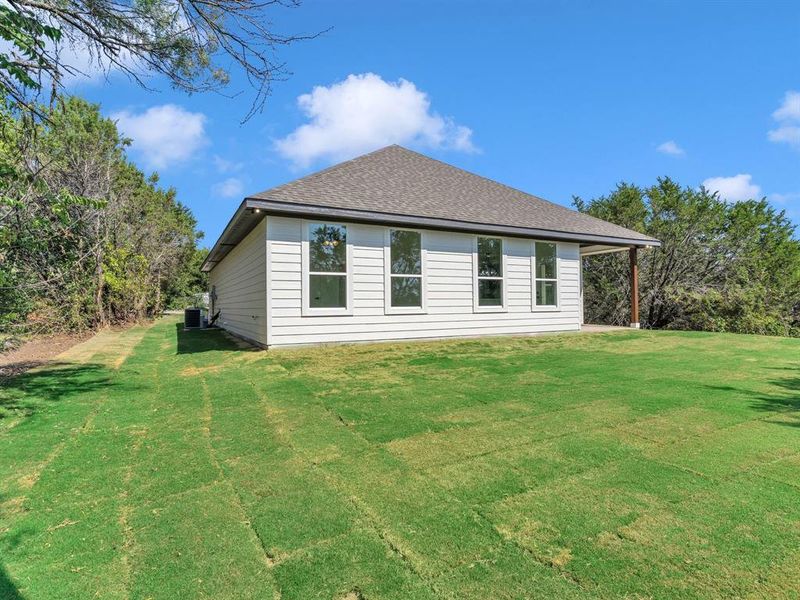Front exterior of a new home in , Granbury, TX, highlighting curb appeal (Image 2). Front exterior of a new home in , Granbury, TX, highlighting curb appeal (Image 2).