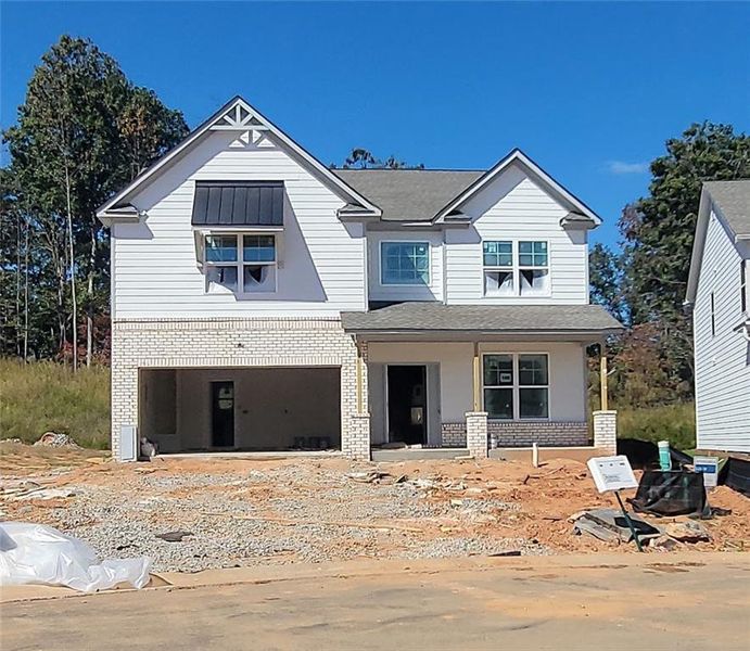 Front exterior of a new home in Clark Farms, Flowery Branch, GA, highlighting curb appeal (Image 1). Front exterior of a new home in Clark Farms, Flowery Branch, GA, highlighting curb appeal (Image 1).