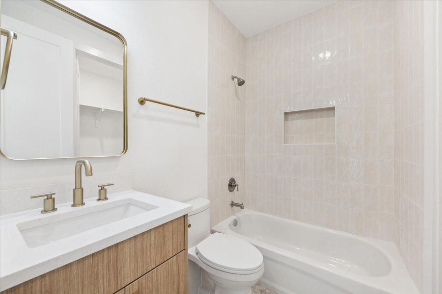 This is the third level guest bedroom bath, so elegant and neutral. In the mirror's reflection you can see a portion of the walk-in closet. This is the third level guest bedroom bath, so elegant and neutral. In the mirror's reflection you can see a portion of the walk-in closet.