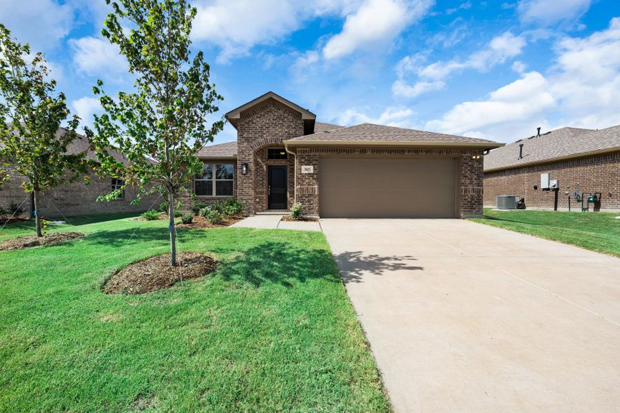 Front exterior of a new home in Fox Landing, Caddo Mills, TX, highlighting curb appeal (Image 16). Front exterior of a new home in Fox Landing, Caddo Mills, TX, highlighting curb appeal (Image 16).