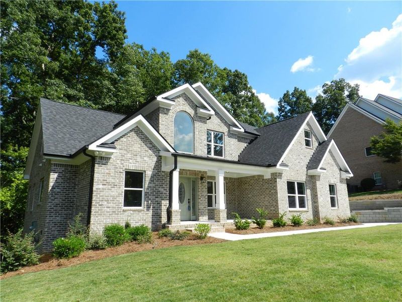 Front exterior of a new home in , McDonough, GA, highlighting curb appeal (Image 22). Front exterior of a new home in , McDonough, GA, highlighting curb appeal (Image 22).