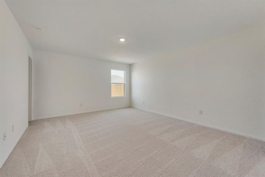 Spare room with light colored carpet