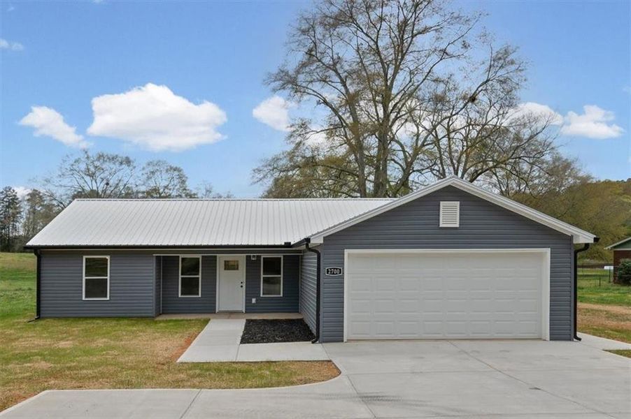 Front exterior of a new home in , Rome, GA, highlighting curb appeal (Image 1). Front exterior of a new home in , Rome, GA, highlighting curb appeal (Image 1).