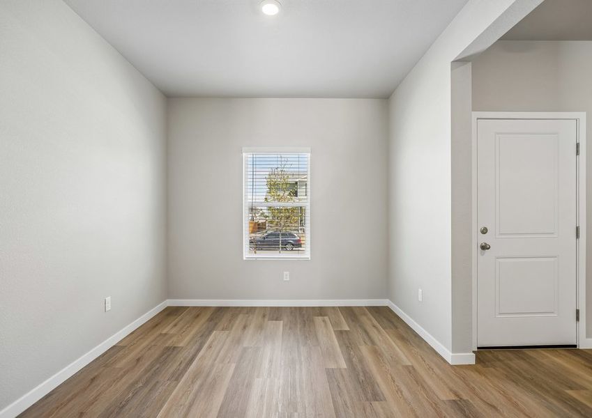 There is a dining room in the front of the home off the kitchen