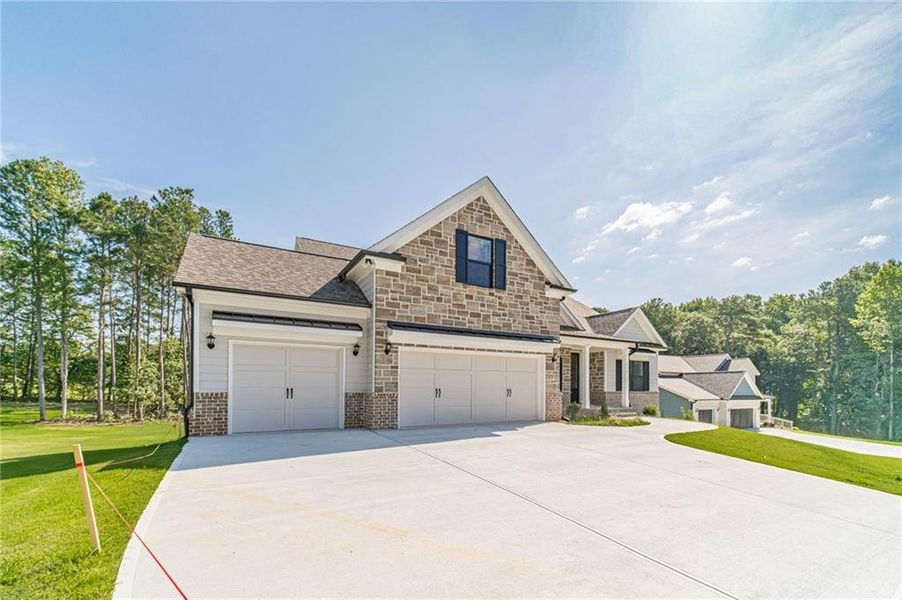 Front exterior of a new home in , Loganville, GA, highlighting curb appeal (Image 22).