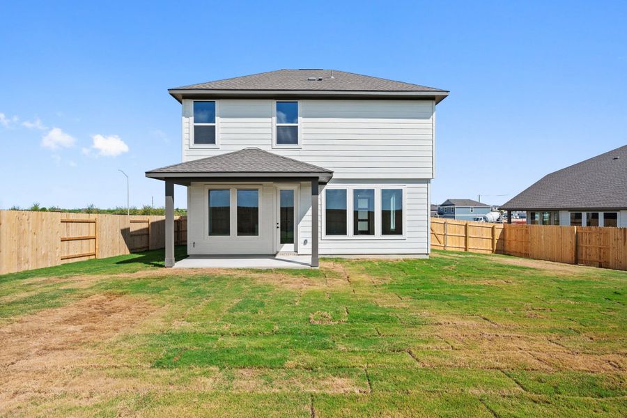 Exterior details and patio area of a home in Terrace Collection At Turner's Crossing, Buda (Image 30).