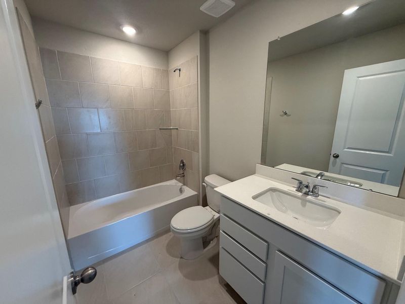 Furnished interior view inside a new home in Midtown Reserve, College Station (Image 4).