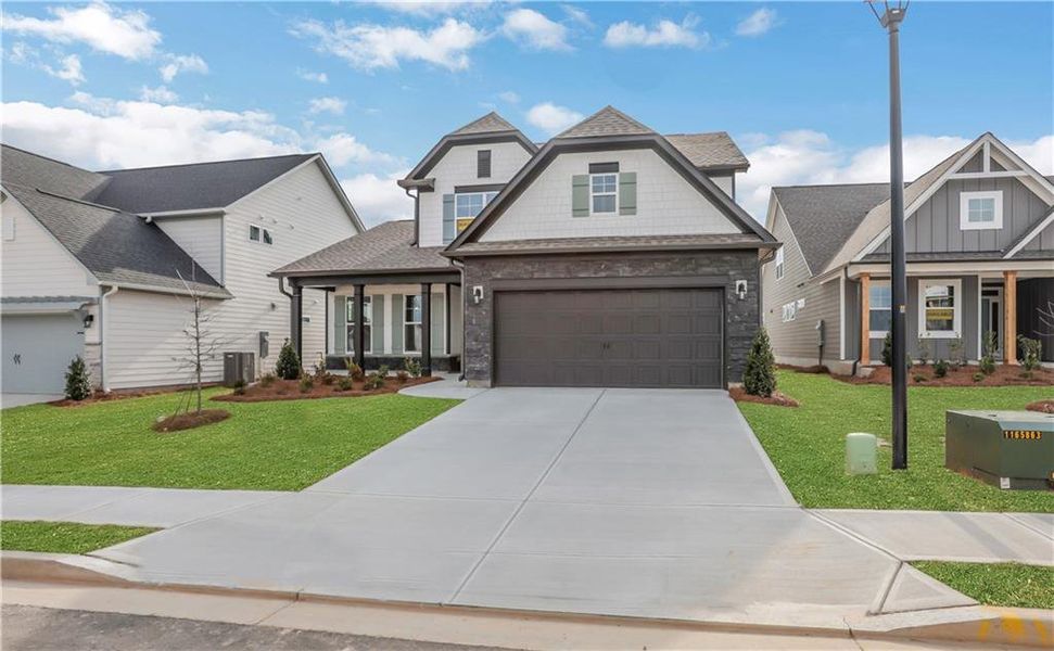 Front exterior of a new home in Twin Lakes, Hoschton, GA, highlighting curb appeal (Image 2).