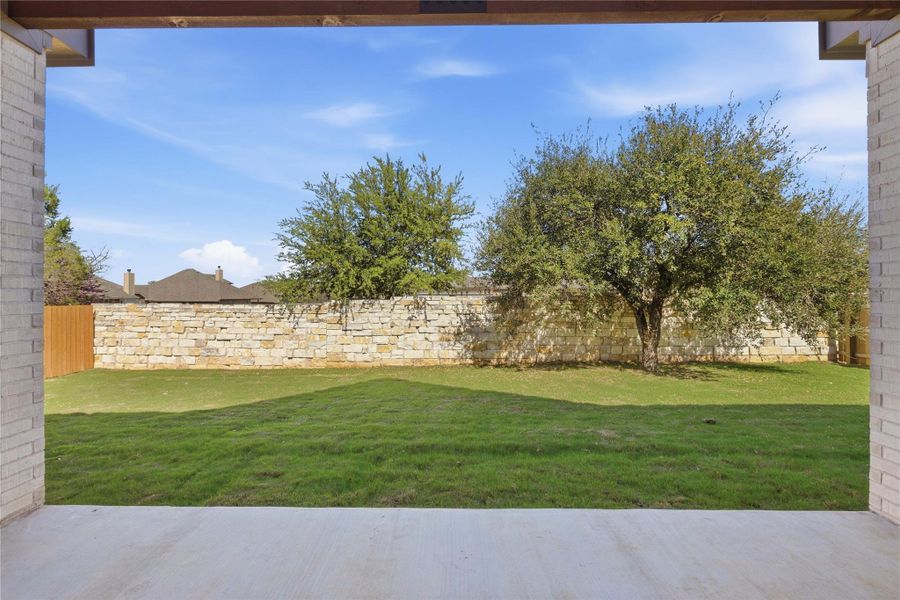 Exterior details and patio area of a home in Oaks at San Gabriel, Georgetown (Image 17).
