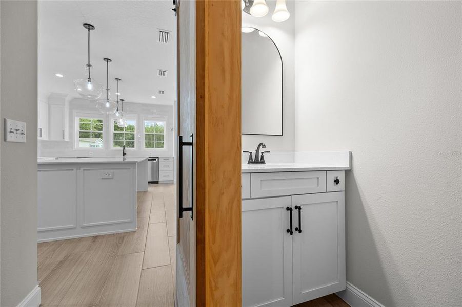 Powder bath next to kitchen