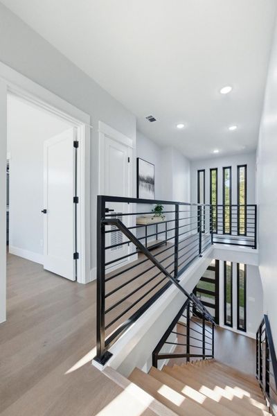 Stairs with wood finished floors and recessed lighting Stairs with wood finished floors and recessed lighting
